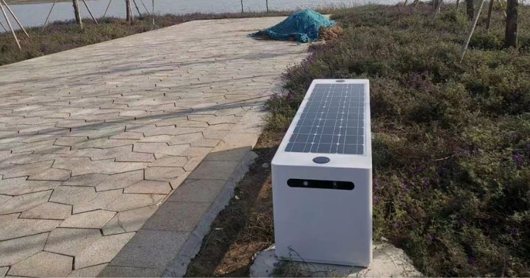 Solar charging bench near a lake