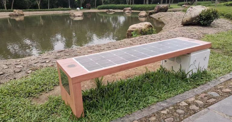 Solar powered bench in a park setting
