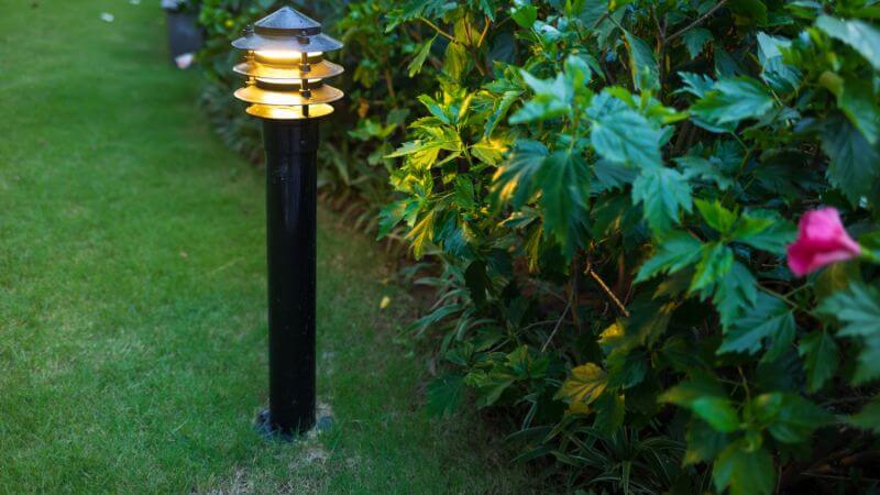 Electric outdoor lights illuminating a garden