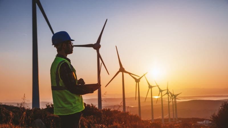 Wind turbines against the backdrop of a sunset